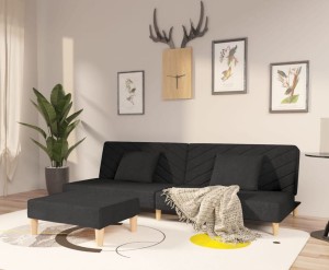 Czarna sofa z podnóżkiem rozkładana