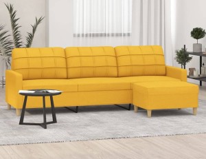 Żółta sofa na nóżkach z ruchomym podnóżkiem