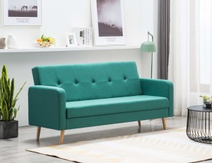 Zielona tapicerowana sofa rozkładana do salonu